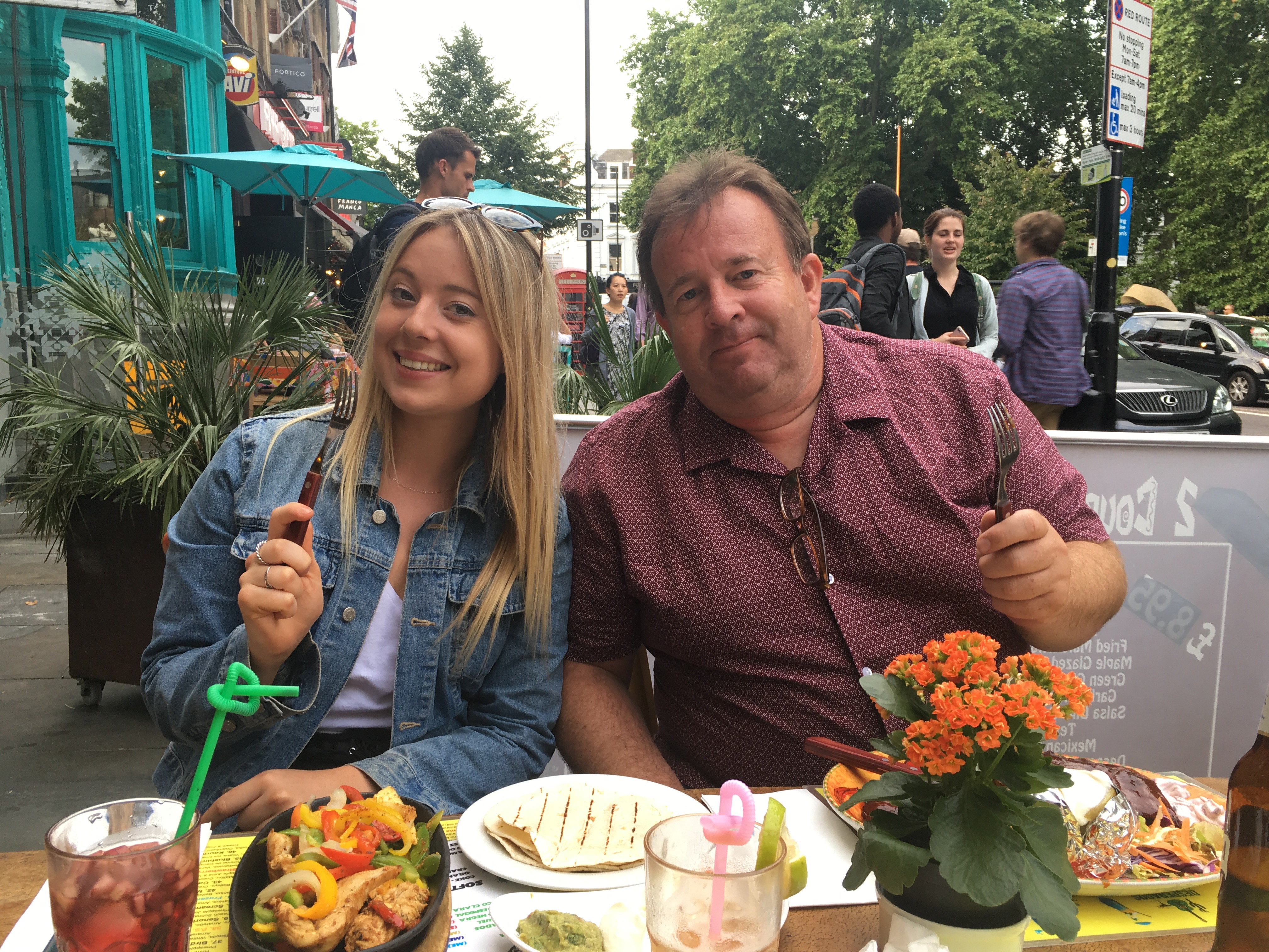 Michelle and her father together at a restaurant