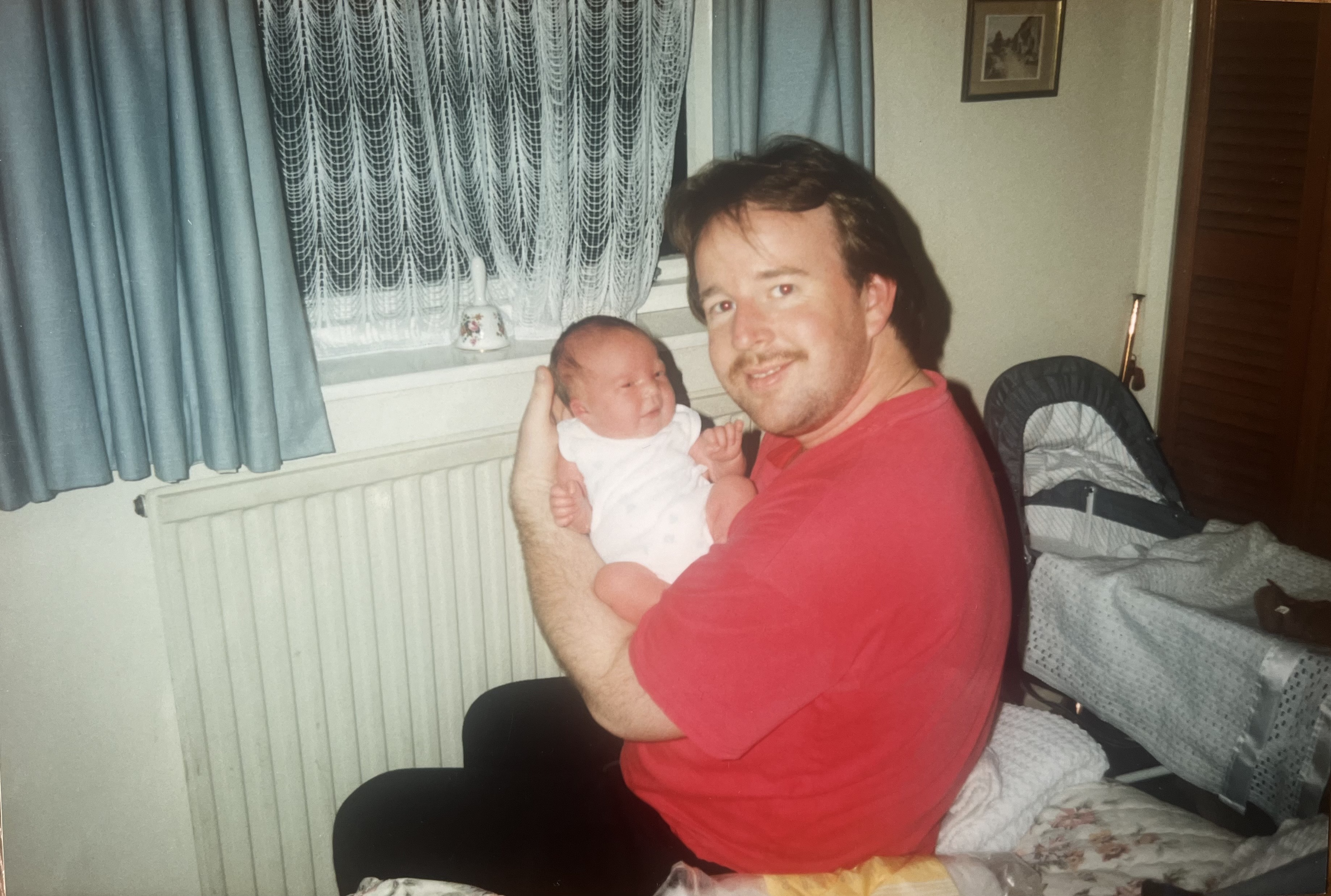 Michelle's father holding his daughter