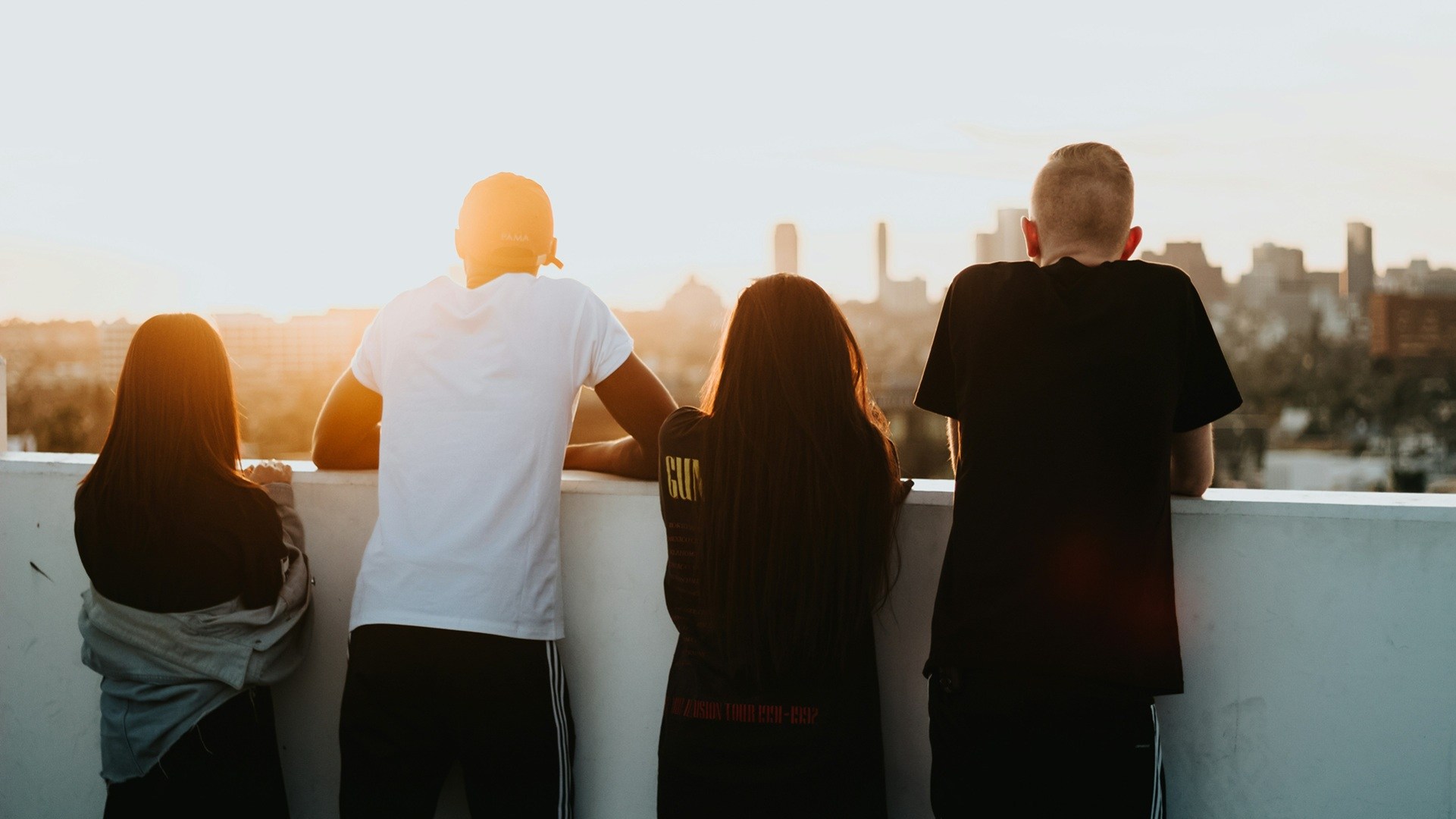 young people looking out on the sunset