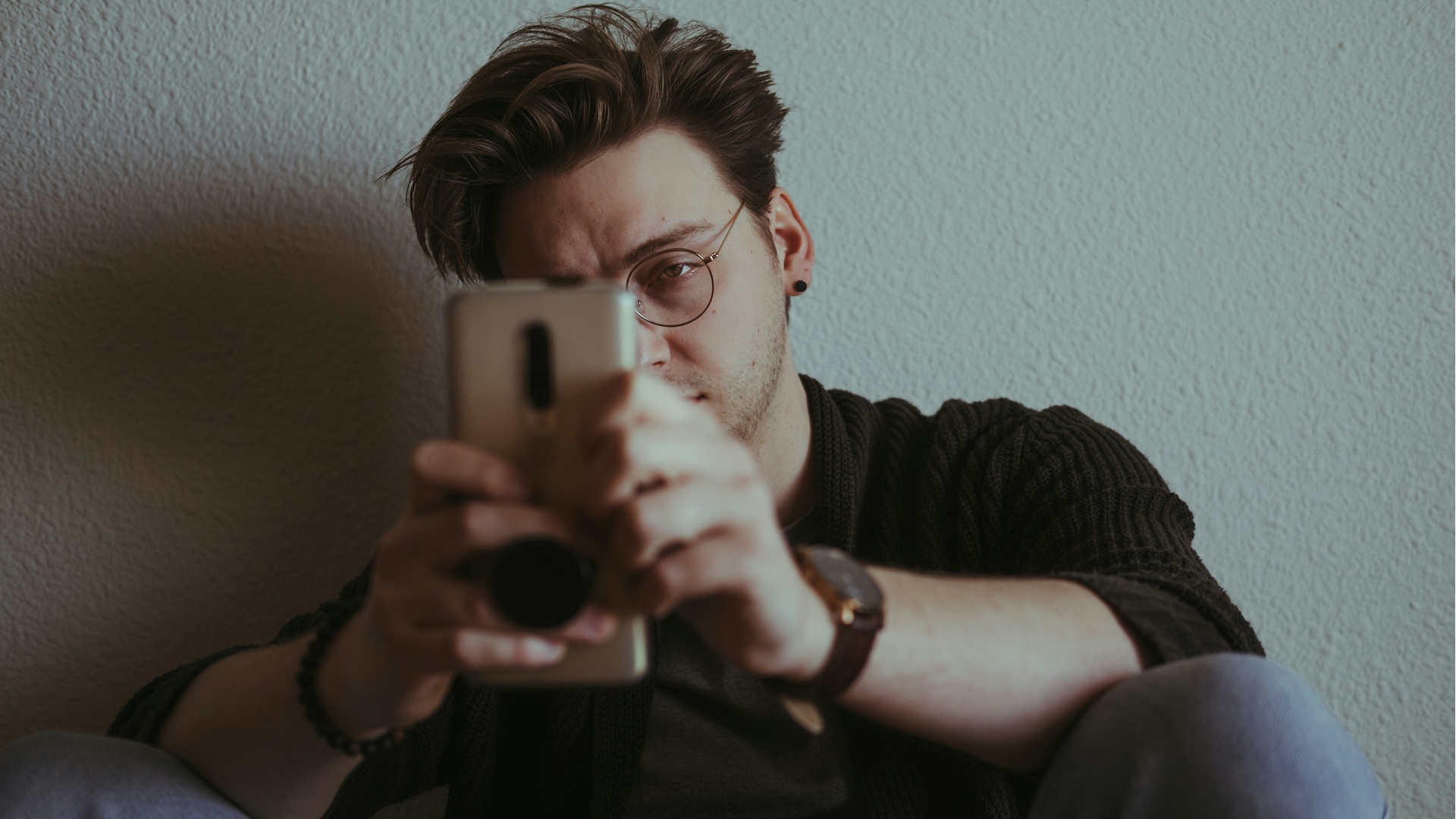A man looking at a phone