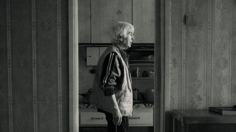 an elderly person looking out