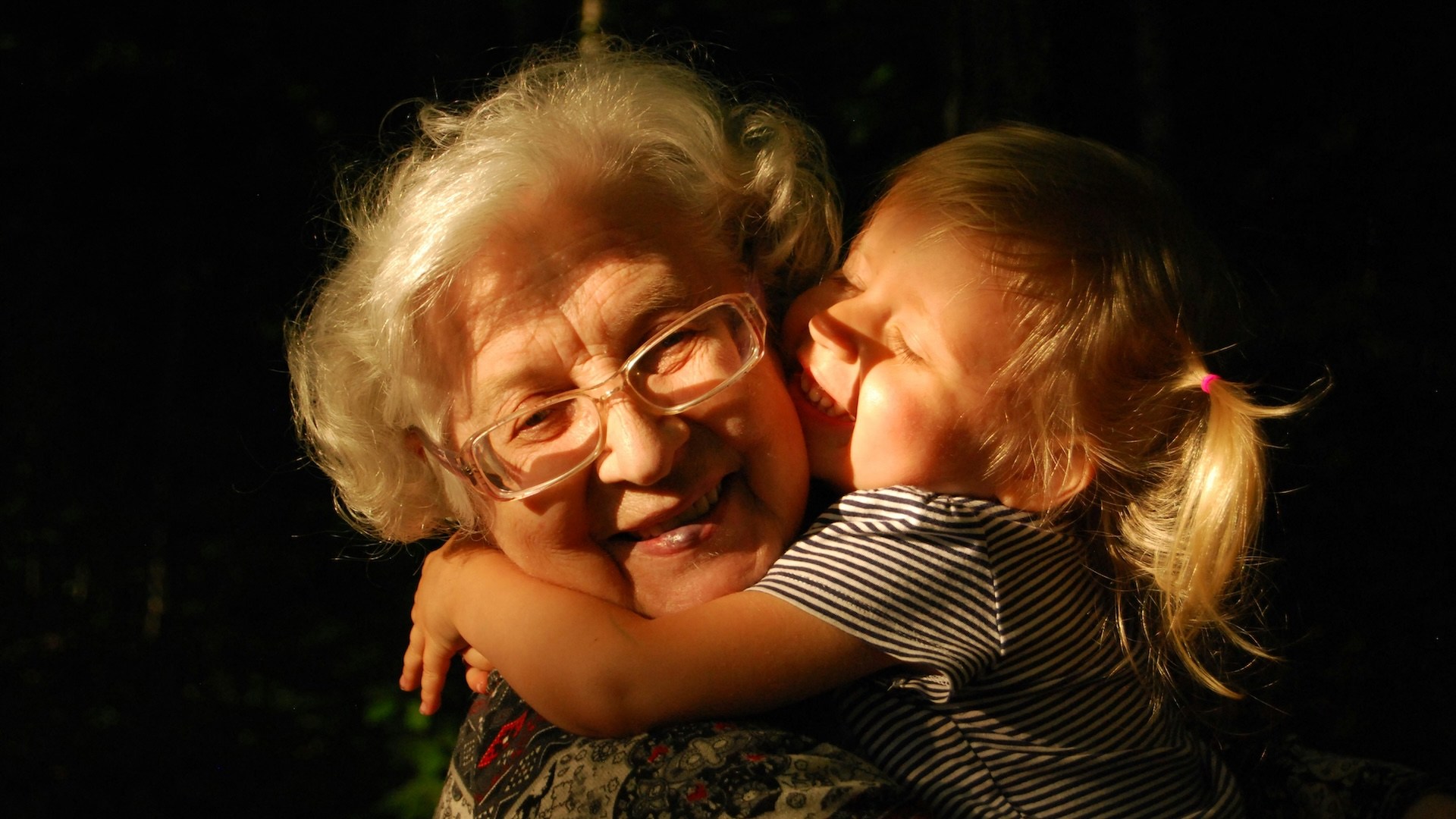 An elderly woman and child.