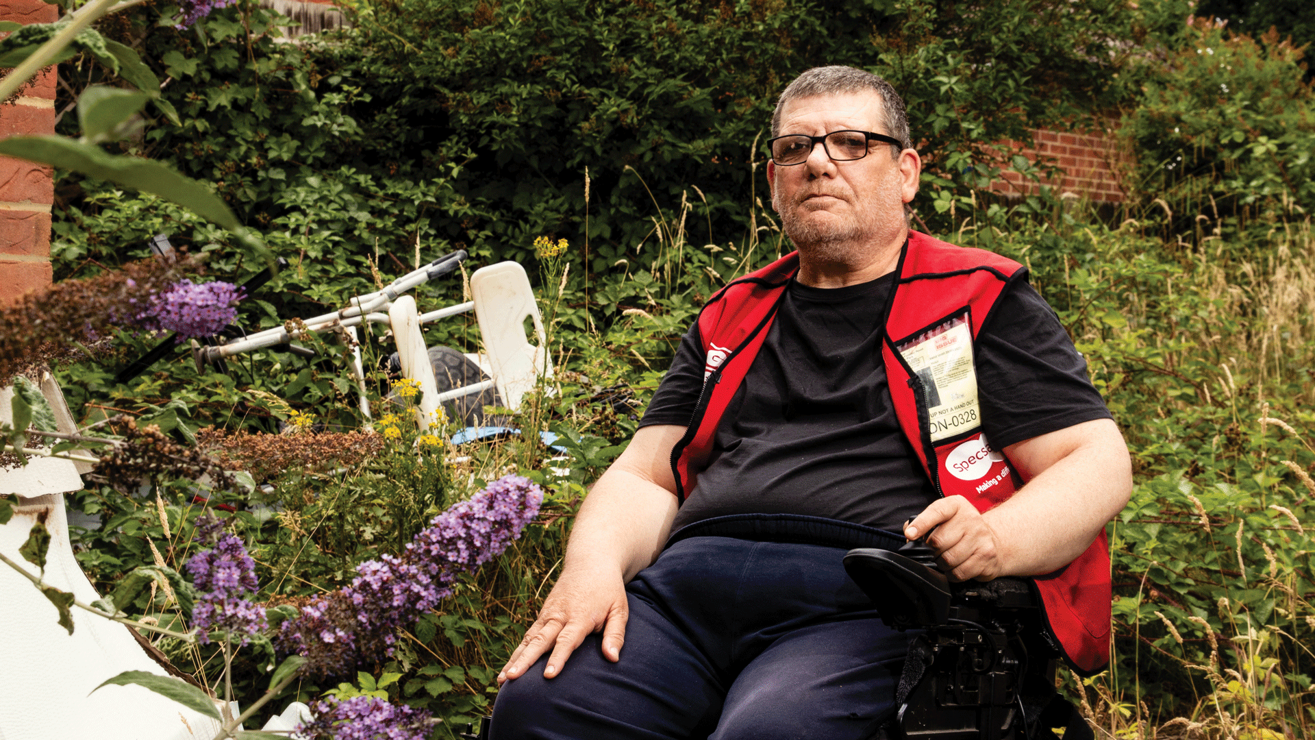 Big Issue vendor Jason Sallis pictured in his overgrown garden
