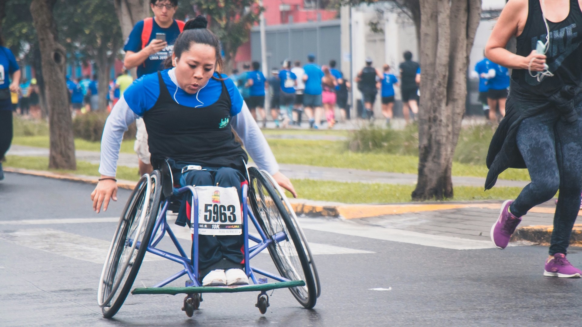 A person racing in a wheelchair. I