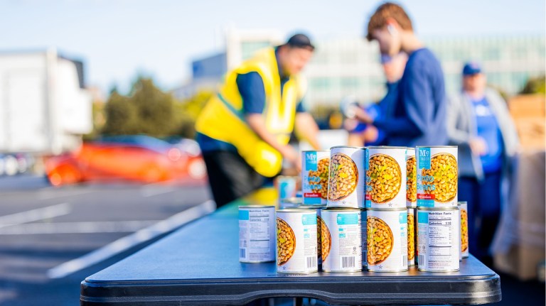 Some donated cans at the end of a table